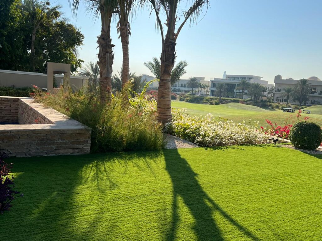 Professional garden maintenance team caring for plants and lawns in Al Furjan Dubai