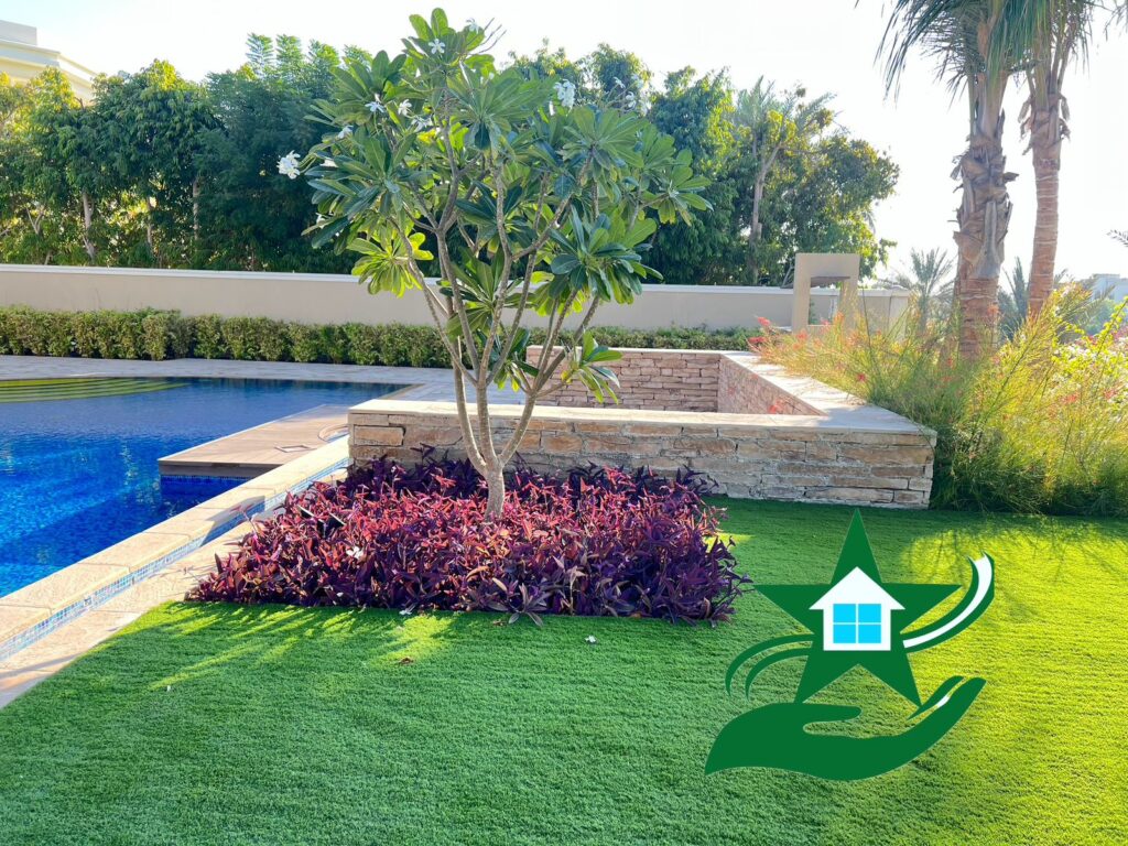 Expert gardeners maintaining luxury villa gardens and healthy plants in Palm Jumeirah Dubai