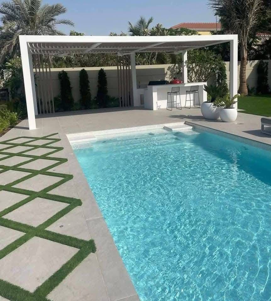 Luxury swimming pool construction in Jumeirah Golf Estates Dubai with modern design