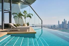 Modern swimming pool renovation in Jumeirah Park villa with new tiles and LED lighting